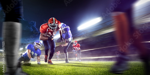 Valokuva american football players in action on grand arena
