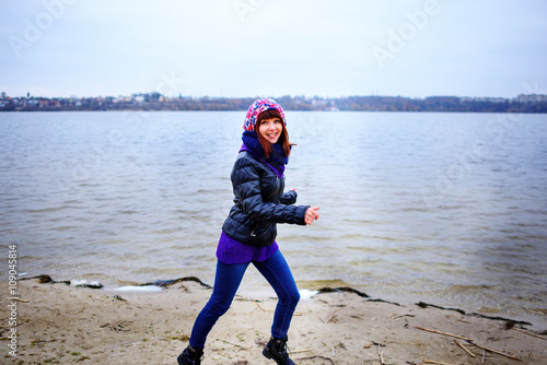 Woman running at beach smiling © cezarksv
