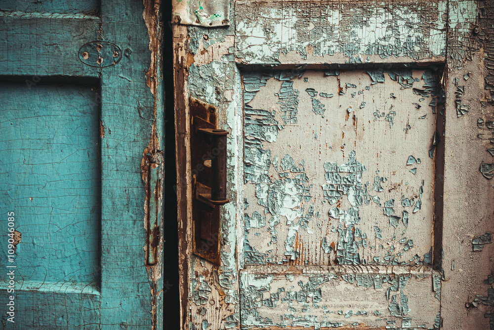 The texture of old door, which the old paint flaking