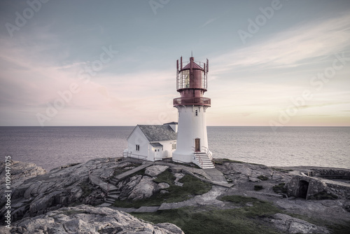 Lighthouse Lindesnes Fyr at evening on most southern point of Norway, Europe, Vintage filtered style 