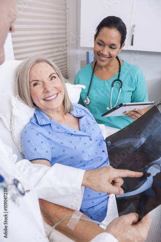 Senior Female Patient With X-ray, Nurse and Male Doctor