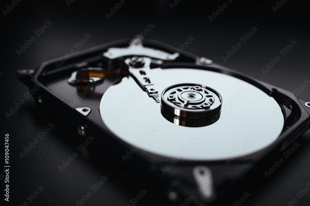 Disassembled hard drive from the computer (hdd) with mirror effects. Part of computer (pc, laptop) Disassembled hard drive from the computer (hdd) with mirror effects. Part of computer (pc, laptop)