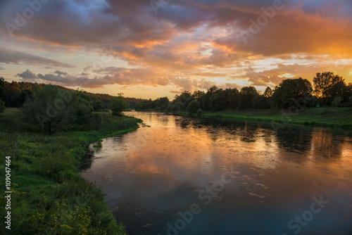 Beautiful summer sunset in the river © Konstantin