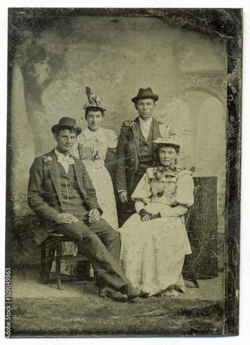 Tintype, circa 1880, USA, of family group posed in studio
