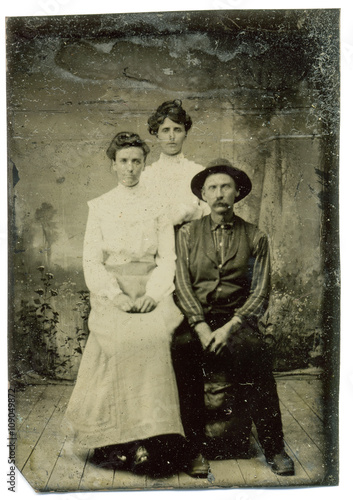 Tintype, circa 1880, USA, of family group posed in studio