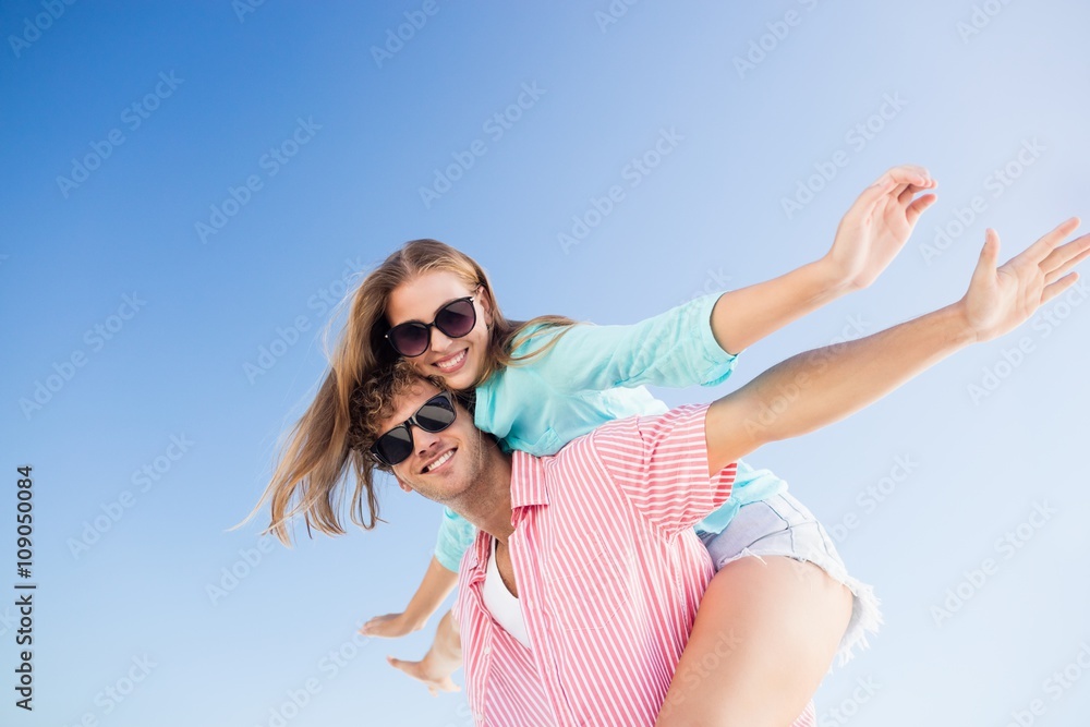 Happy couple posing on the beach 