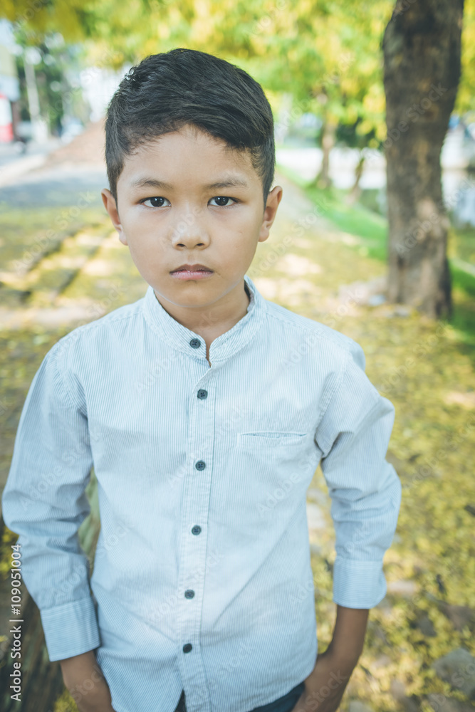 scared and alone, young Asian child who is at high risk of being bullied, trafficked and abused, selective focus scared and alone, young Asian child who is at high risk of being bullied, trafficked and abused, selective focus