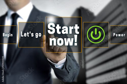 Start now touchscreen is operated by businessman