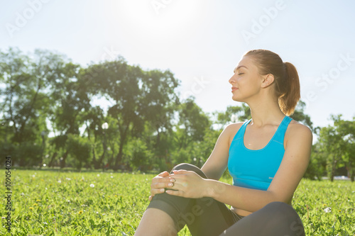 Woman meditating in park