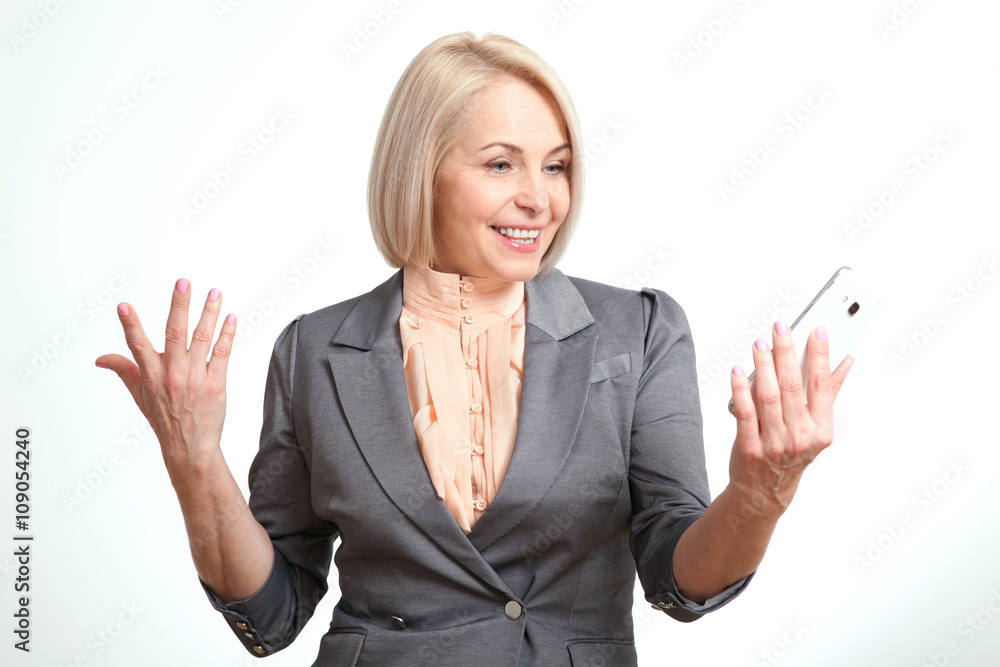 Happy business woman talking on smartphone isolated on white background