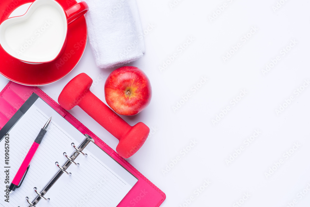Workout plan and sports equipment top view close-up Workout plan and sports equipment top view close-up