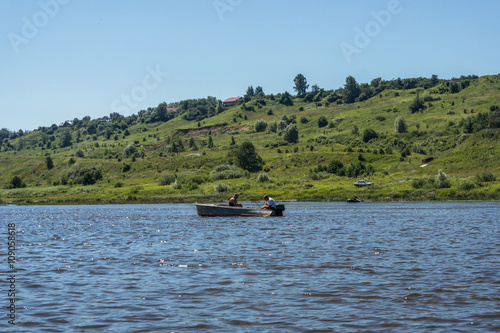 Boat floats on the river. © Alexey Pelikh