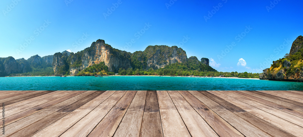 Fototapeta premium wood terrace against panorama Beautiful seascape in shining day