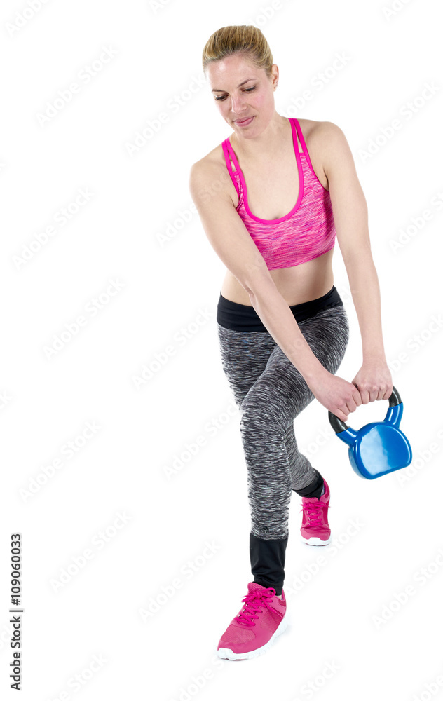Woman doing her kettlebell workout Woman doing her kettlebell workout