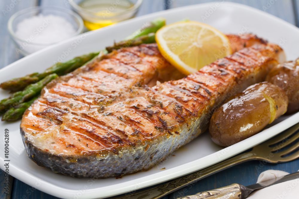 grilled salmon with potato on white dish grilled salmon with potato on white dish