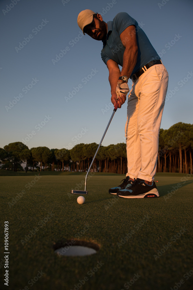Fototapeta premium golfer hitting shot at golf course