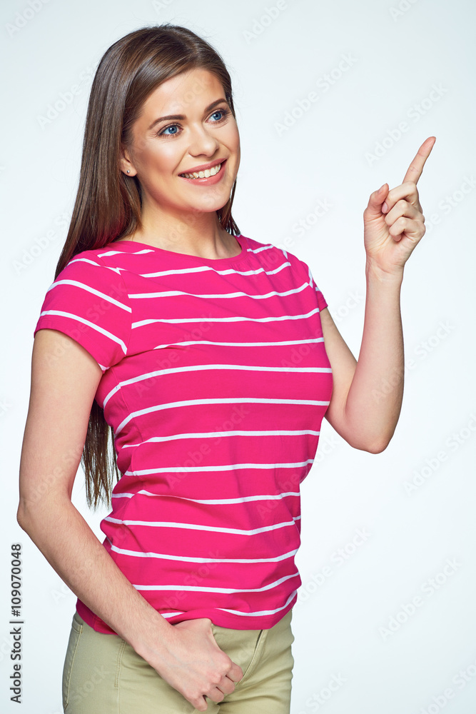 Smiling casual dressed woman pointing on copy space. Smiling casual dressed woman pointing on copy space.