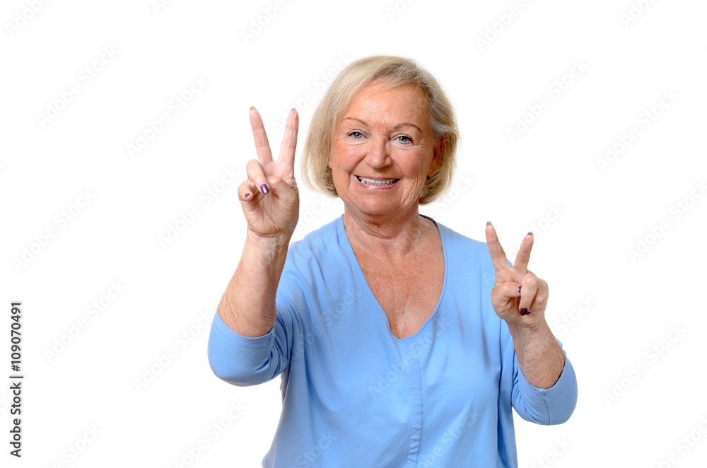 Smiling elderly woman giving a double v-sign Smiling elderly woman giving a double v-sign