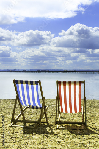 2 Deckchairs on the Beach