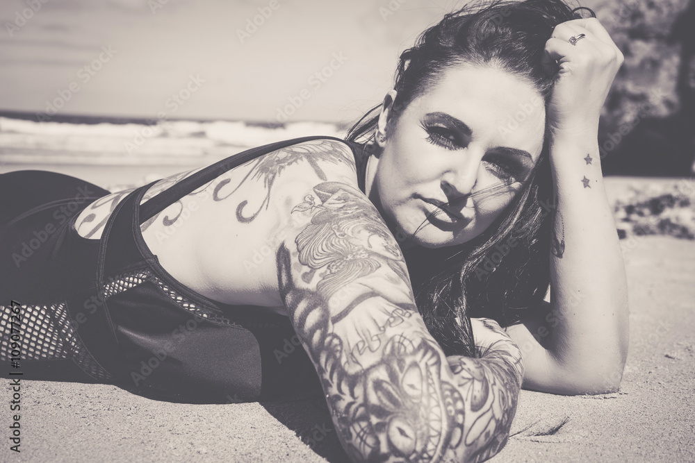 Heavily tattooed plus sized female model
