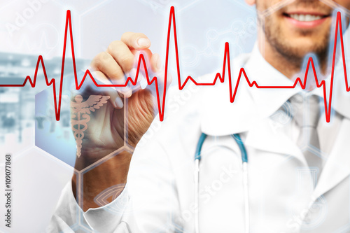 Doctor drawing cardiogram o...