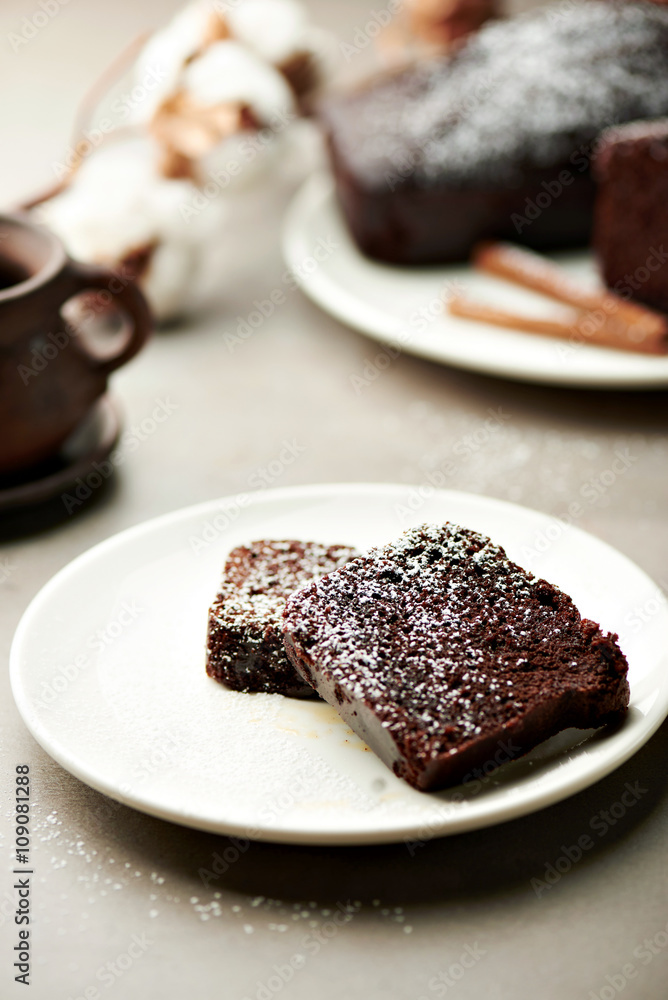 Tasty chocolate cake and cotton flowers