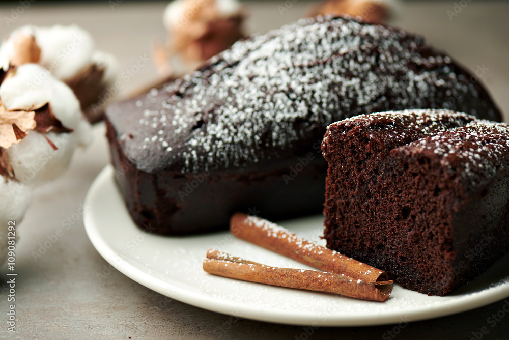 Tasty chocolate cake and cotton flowers Tasty chocolate cake and cotton flowers