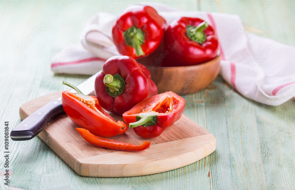 Fresh organic bell peppers on a wooden board Fresh organic bell peppers on a wooden board