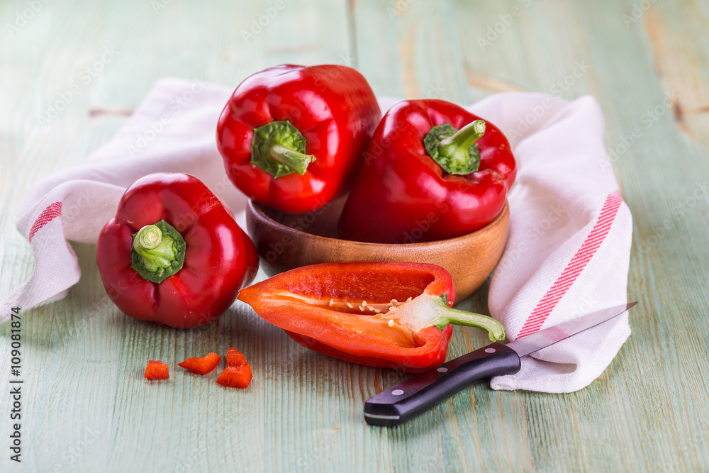 Fresh organic bell peppers on a wooden board Fresh organic bell peppers on a wooden board