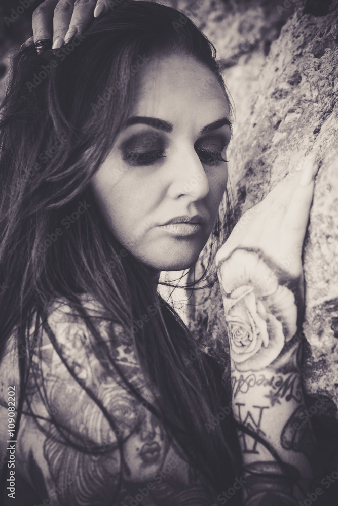 Heavily tattooed plus sized female model