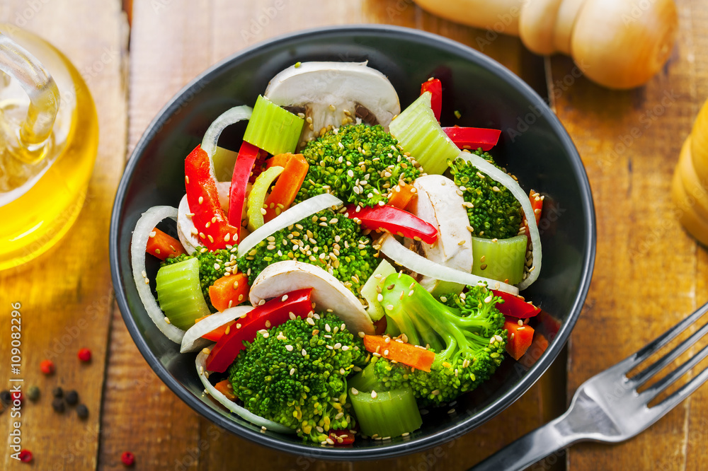 Salad in a bowl made of vegetables.  Healthy vegetarian food. Top view, close-up.