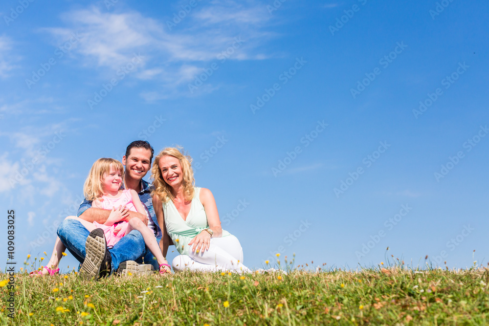 Mother, father, child, sitting in open air Mother, father, child, sitting in open air
