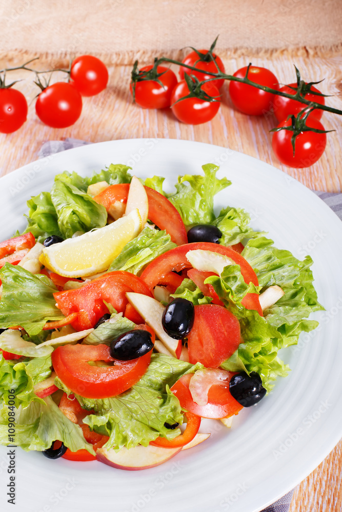 Fresh vegetable salad on the wooden table Fresh vegetable salad on the wooden table