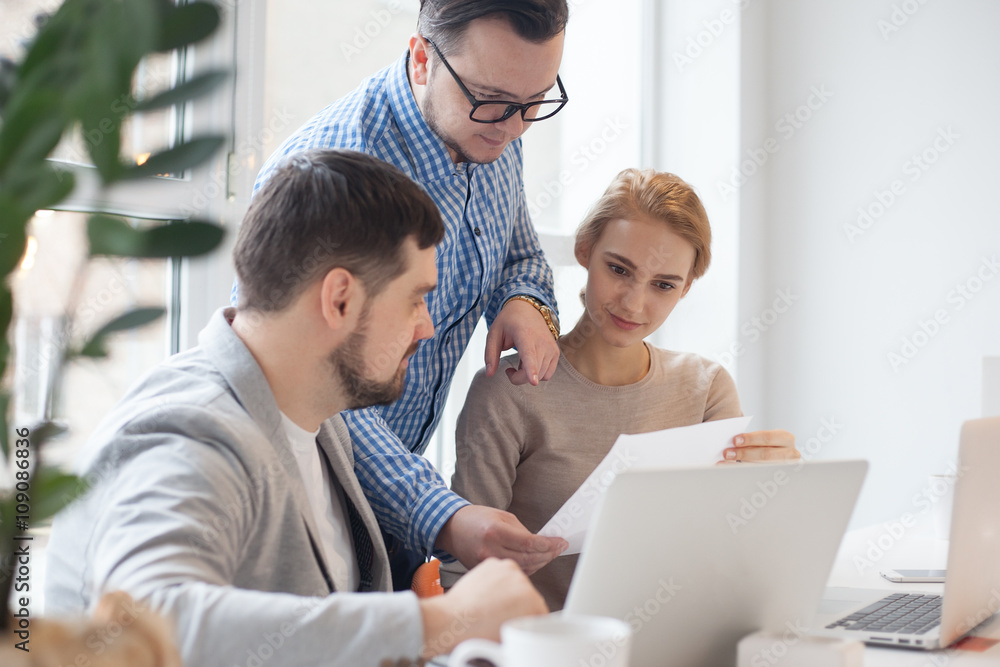 team of three coworkers in stylish studio team of three coworkers in stylish studio