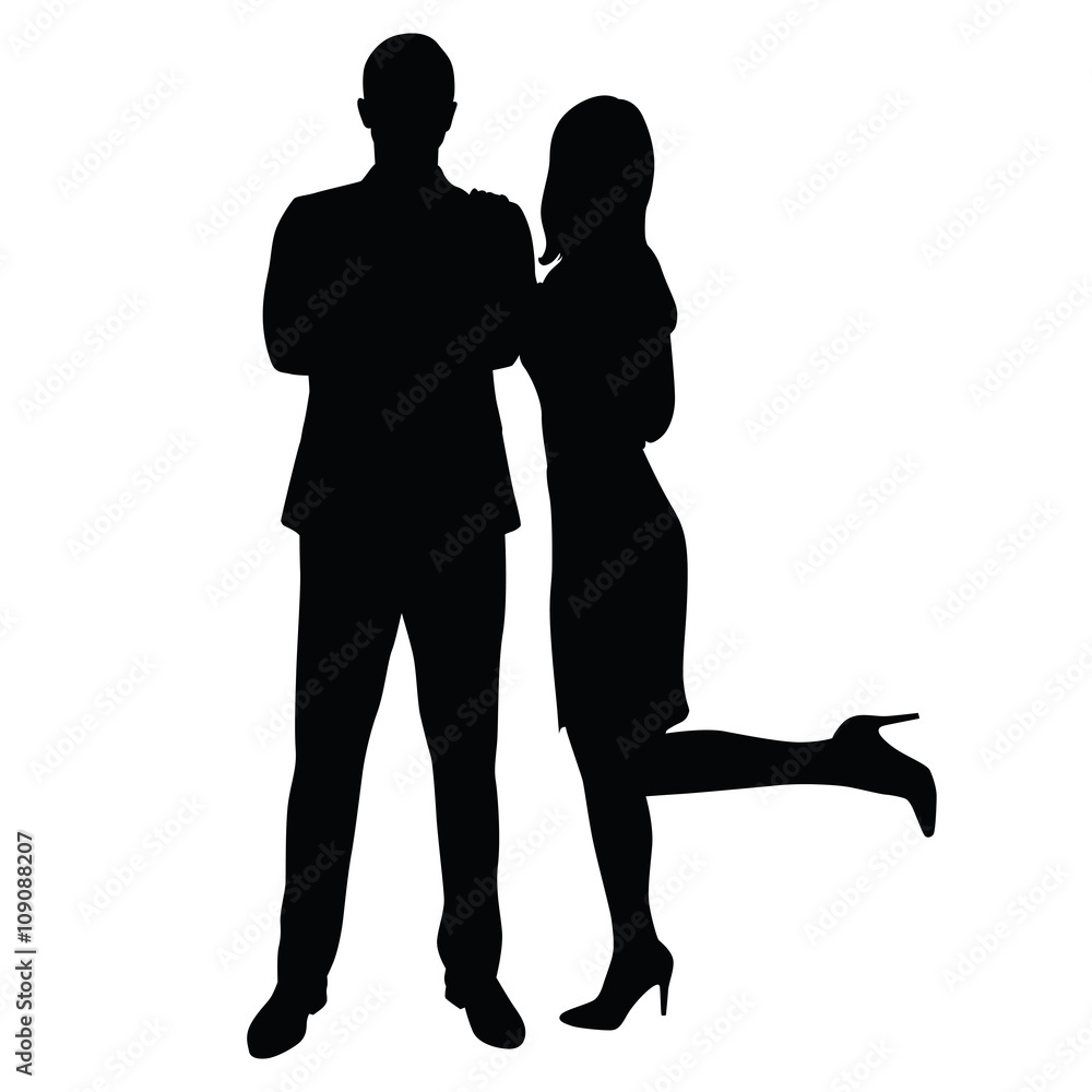 Man in suit standing face with his arms folded, sexy woman cuddl