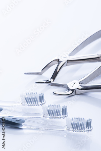 Basic dental tools on white table