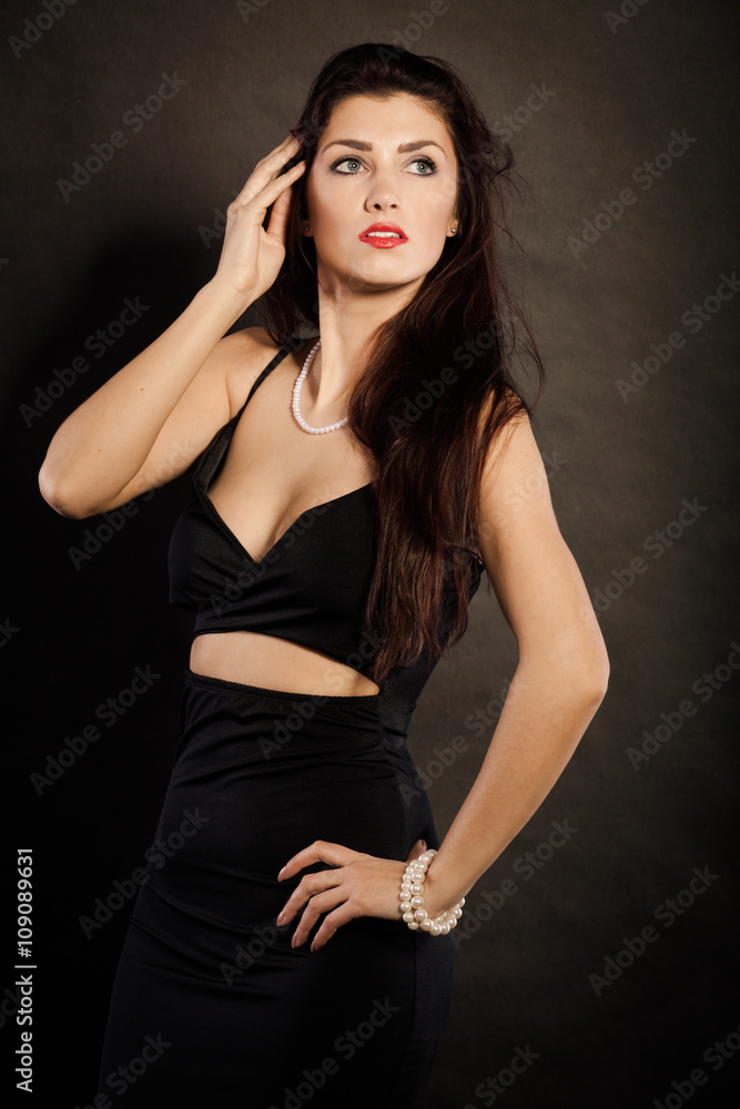 woman in sensual black dress on dark woman in sensual black dress on dark