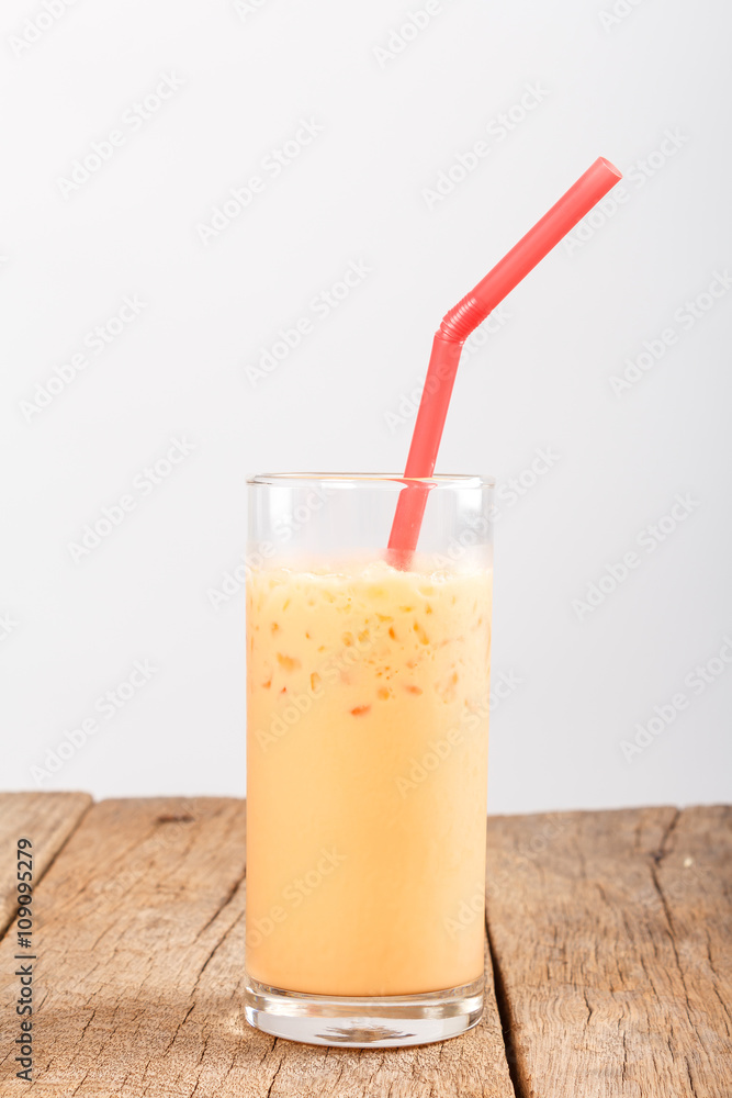 Thai Ice Tea on wooden table Thai Ice Tea on wooden table