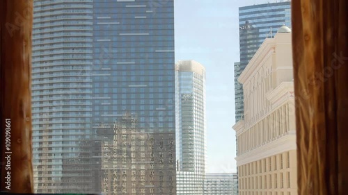 Hotel Window Shades Opening to Sunny Day in Las Vegas