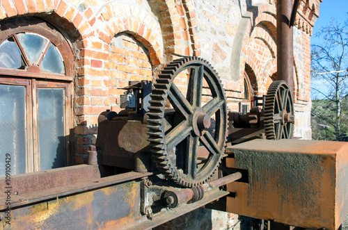 Old rusty gears, machinery parts.