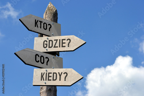 Kto? Gdzie? Co? Kiedy? Signpost in Polish. © PX Media