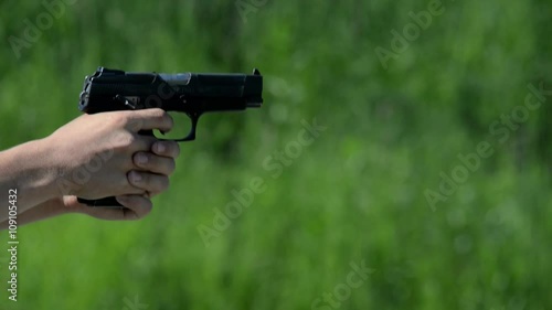 pistol shooting on green background