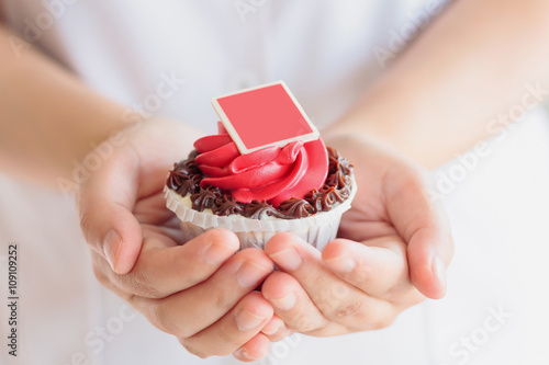 hand hold valentines cupcake