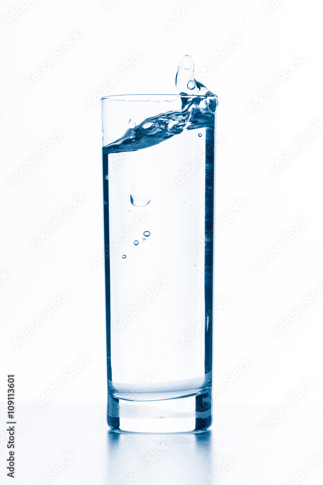 water splashing from glass isolated on white background water splashing from glass isolated on white background