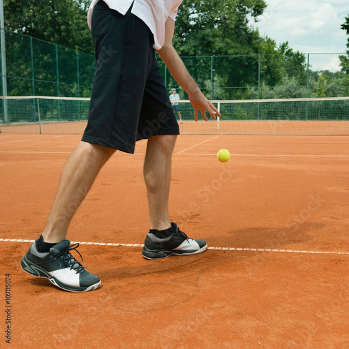 Tennis player on serve © Microgen