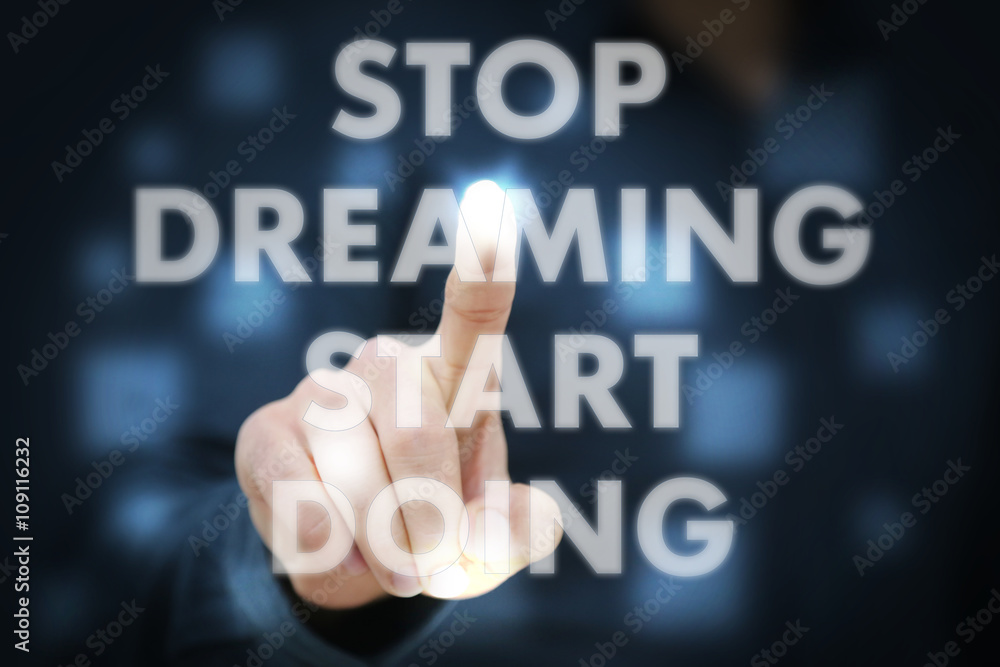 Businessman touching Stop Dreaming Start Doing Businessman touching Stop Dreaming Start Doing