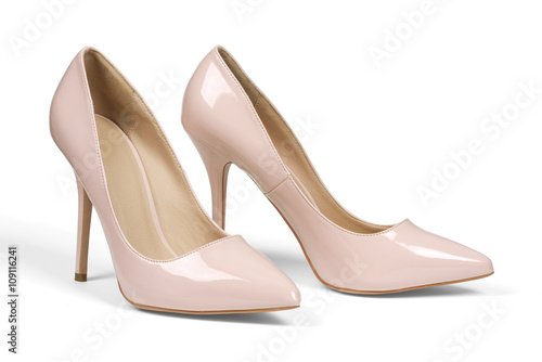A pair of creamy high heel shoes isolated on white with clipping path.
