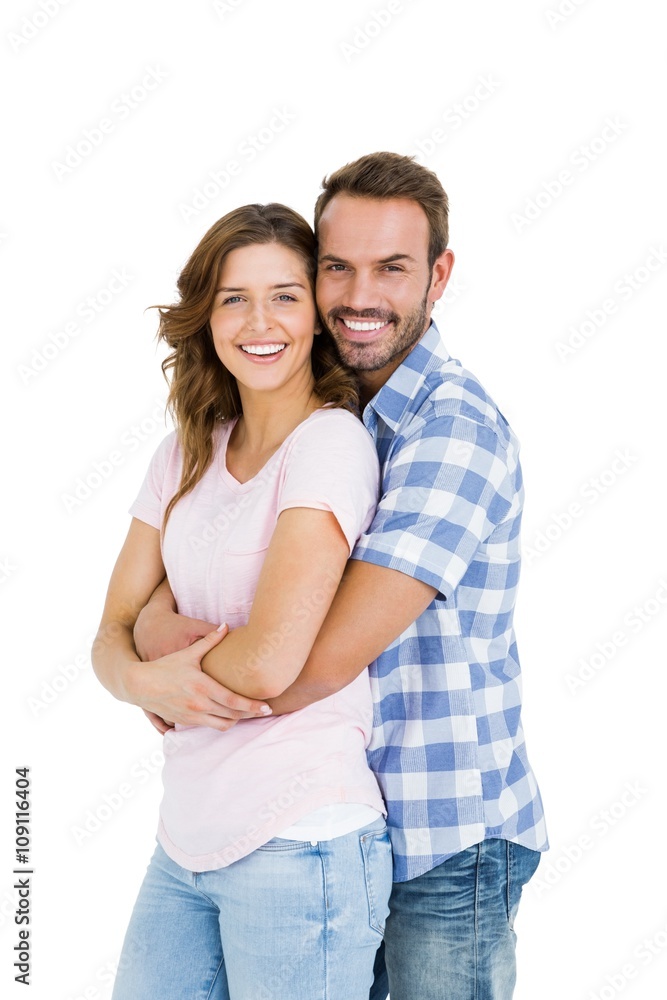 Portrait of happy young couple embracing on white background Portrait of happy young couple embracing on white background
