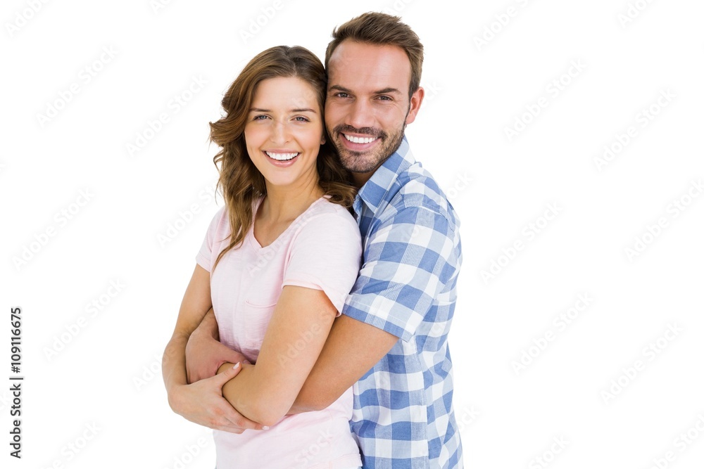 Portrait of happy young couple embracing on white background Portrait of happy young couple embracing on white background