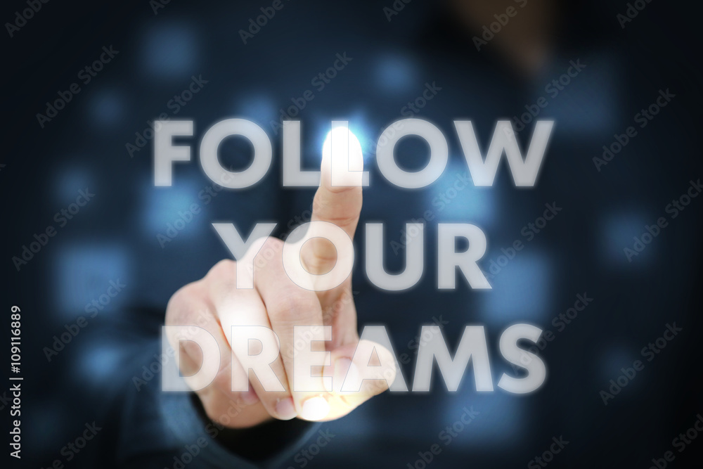 Businessman touching Follow Your Dreams Businessman touching Follow Your Dreams